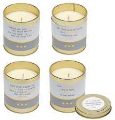 An assortment of 4 tinned candles, each with a heart warming message, gold tin and metallic details.