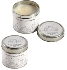 3 Assorted tinned candles each with an apple and cinnamon fragrance and winter street inspired print with star detail. 