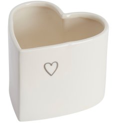 A simple yet stylish heart shaped ceramic planter with little heart print detail. 