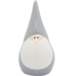 A cute small ceramic Santa decoration with grey clothing and pointed hat details. 