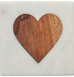 A beautiful marble coaster with an inlaid wooden heart detail. 