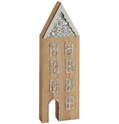 A wooden house standing decoration with festive theme and details including glitter snow, roof and windows!