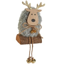 An adorable little reindeer with a fluffy pom pom body and decorative gold antlers and twine bow. 
