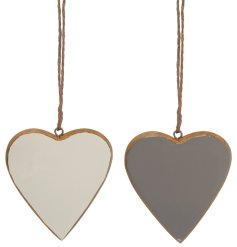 An assortment of 2 wooden hearts, each with an enamel finish in a stylish grey or cream colour. 