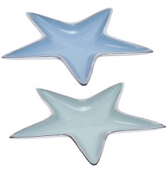 An assortment of aluminium star shaped dishes with a colourful finish. 