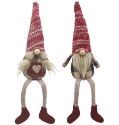An assortment of Mr and Mrs gonk shelf sitting decorations, each with fluffy hair and knitted hats.