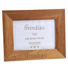 A beautifully natural oak frame engraved with Ffrindiau which is Friends in welsh.