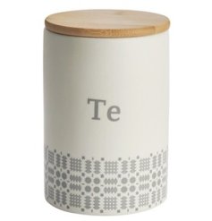 A stylish tea canister storage jar with Welsh "Tea" text and blanket stitch pattern in grey. 