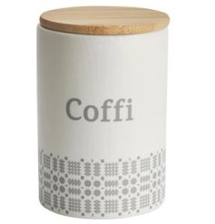 A pretty kitchen canister with "Coffee" written in Welsh and with grey blanket stitch pattern and wooden lid.