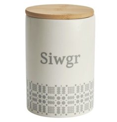 A pretty kitchen canister storage jar with "Sugar" written in Welsh and grey blanket stitch style pattern.