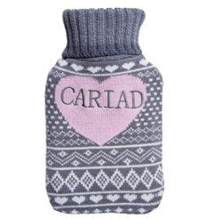 A pretty grey, white and pink hot water bottle/cover with heart details and "love" message in Welsh. 