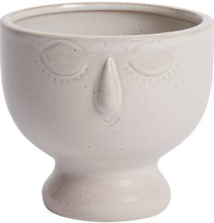 A stylish planter with a speckled finish and charming detailed face. A must have gift item and interior accessory