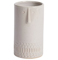 A stylish and beautifully crafted small face vase with a natural glaze and speckled finish. 