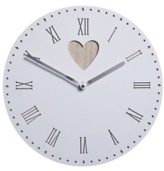 A pretty vintage inspired clock featuring cut out pattern and heart detail with a simple and stylish design.