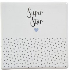 A pretty coaster with polka dot pattern, contrasting purple heart detail and "super star" text!