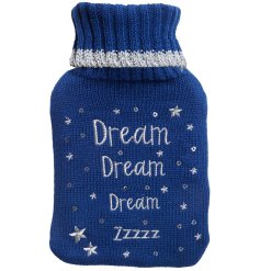 A cute hot water bottle and knitted cover with silver embroidered "dream dream dream zzz" text and star and sequins.
