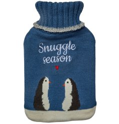 A cute hot water bottle and knitted cover with "snuggle season" text and cute penguin and heart detail.