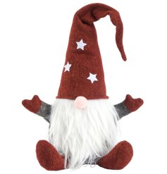 A festive gonk doorstop featuring red gloves and hat and white star detail. 