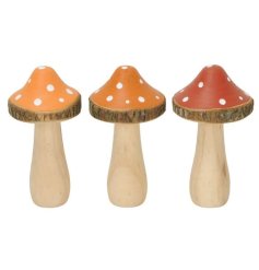 3 Assorted mushroom decorations, each made from wood with a bark edge and colourful top with spot design. 