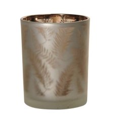 A glass tea light holder with a bronze metallic leaf design inside a frosted glass outer layer. 
