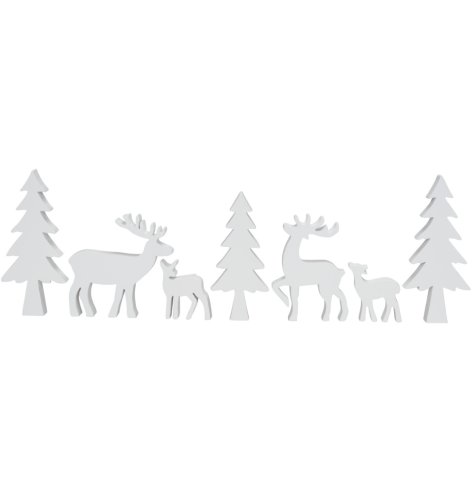 A 7 piece set of freestanding decorations depicting a winter wonderland scene containing Christmas trees and stag/deers