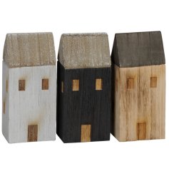 An assortment of 3 wooden house shaped blocks with window detail design. 