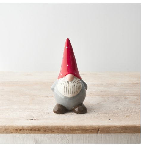 A traditional gonk ornament with a glossy finish, detailed beard and red and white polka dot hat. 