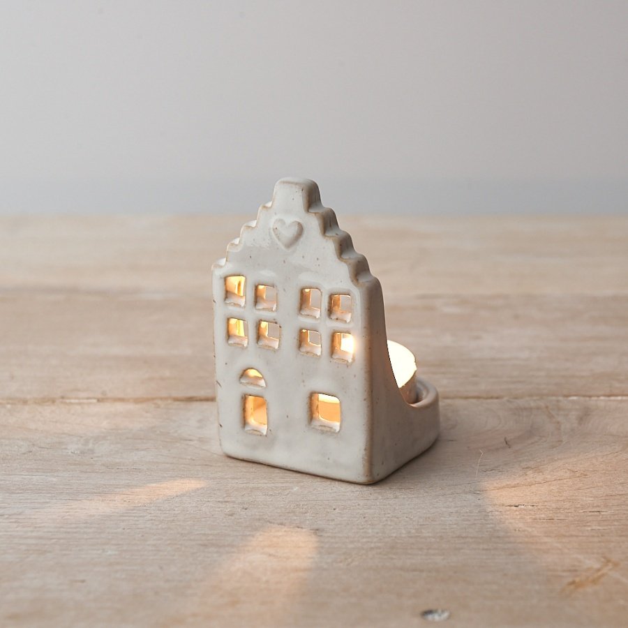 A charming ceramic t-light holder with a rustic finish and natural glaze. 