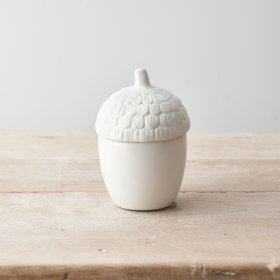 A classic acorn shaped container with a white glaze and fabulous detail. 