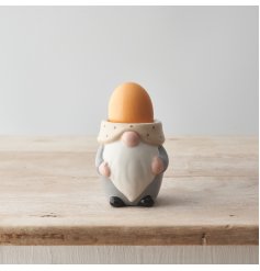 A novelty gonk shaped egg cup in natural colours with polka dot detailing. 