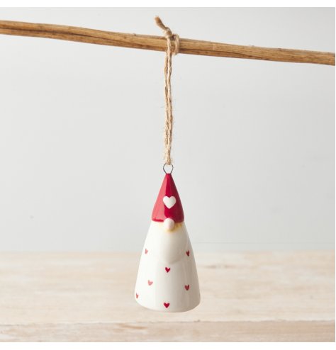 A cute and quirky ceramic gonk decoration with red polka hearts and a rustic jute string hanger.