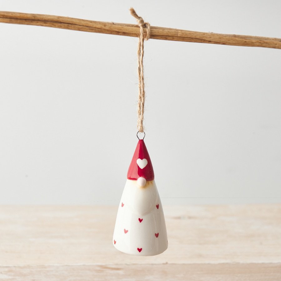 A beautiful and unique ceramic gonk decoration with red polka dot hearts and a rustic jute string hanger.