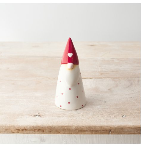 A chic ceramic gonk ornament with red dainty hearts.