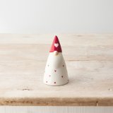 A chic gonk ornament decorated with red hearts