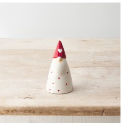 A chic ceramic gonk ornament in attractive red and white colours. Decorated with a sweet red heart design. 