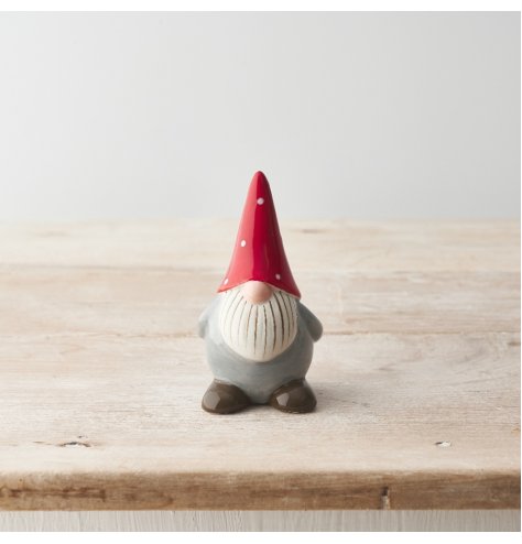 A charming ceramic gonk ornament with a red and white polka dot hat and detailed beard. 