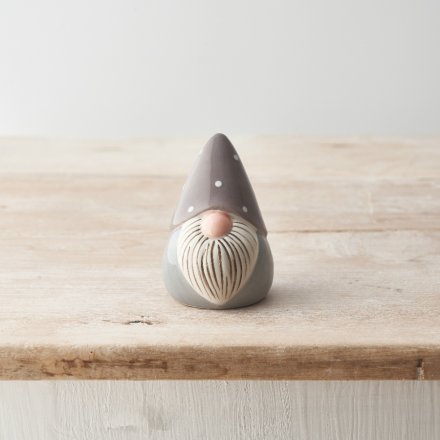 A chic ceramic gonk ornament with a detailed beard and polka dot hat. Painted with a neutral grey glaze. 