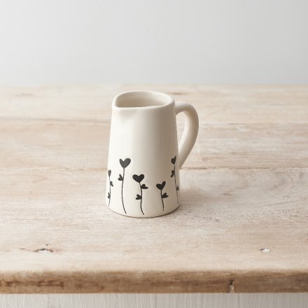 A charming jug with a beautiful floral design in black. 
