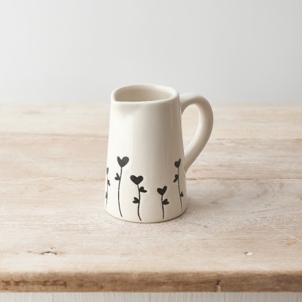 A chic jug with a black floral design. A stylish seasonal accessory for the home. 