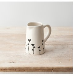 A chic jug with a black floral design. A stylish seasonal accessory for the home. 