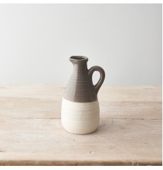 A chic two tone ceramic jug with a warm grey glaze. A charming interior accessory.