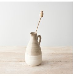 A chic two-tone natural jug with dainty spout and handle. A stylish interior accessory. 