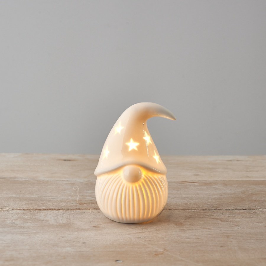 A chic ceramic gonk ornament with warm glow led lights inside. A shiny white ceramic item which looks beautiful when lit