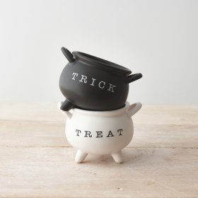 2 Assorted design ceramic cauldrons each with a monochrome design and simple "trick" or "treat" message.