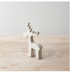 A contemporary ceramic reindeer ornament with a rustic natural finish. A stylish interior item for the home. 
