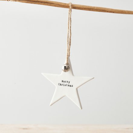 A hanging Merry Christmas star with silver jingle bell and jute string. 