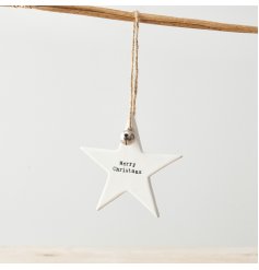 A chic white ceramic star decoration with a jute string hanger, silver bell and stamped Merry Christmas slogan. 