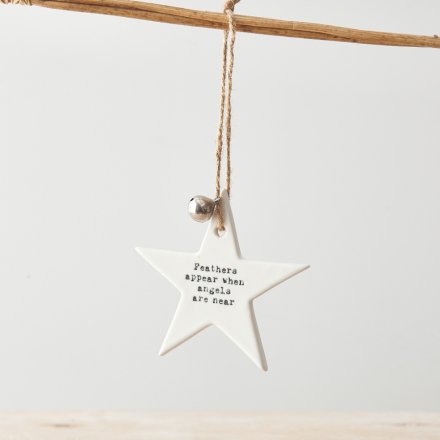 Feathers appear when angels are near. A beautiful and sentimental ceramic star decoration with silver bell and jute 