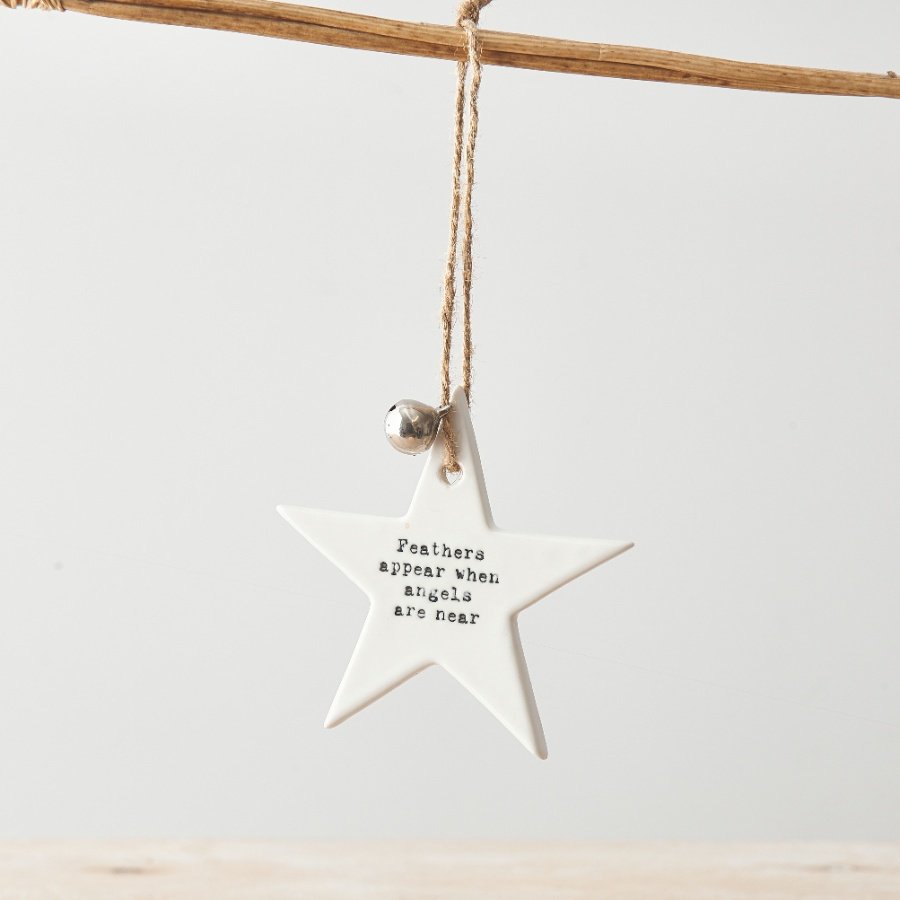 A chic ceramic star decoration with a stamped sentimental slogan and silver jingle bell. 