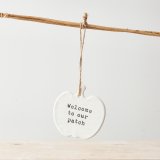 A stylish ceramic pumpkin shaped sign with a cute 'Welcome to Our Patch' slogan. 
